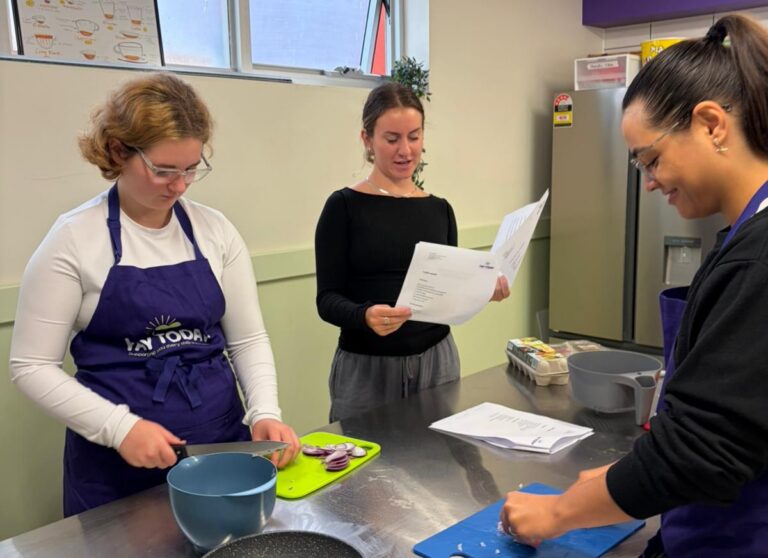 NDIS participants cooking with a support worker at YAY Today.