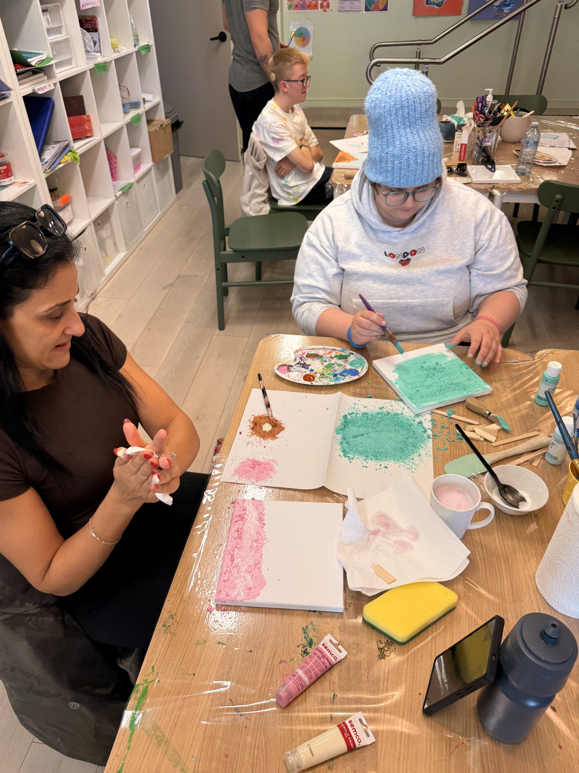 Participants making art at a YAY Today creative workshop