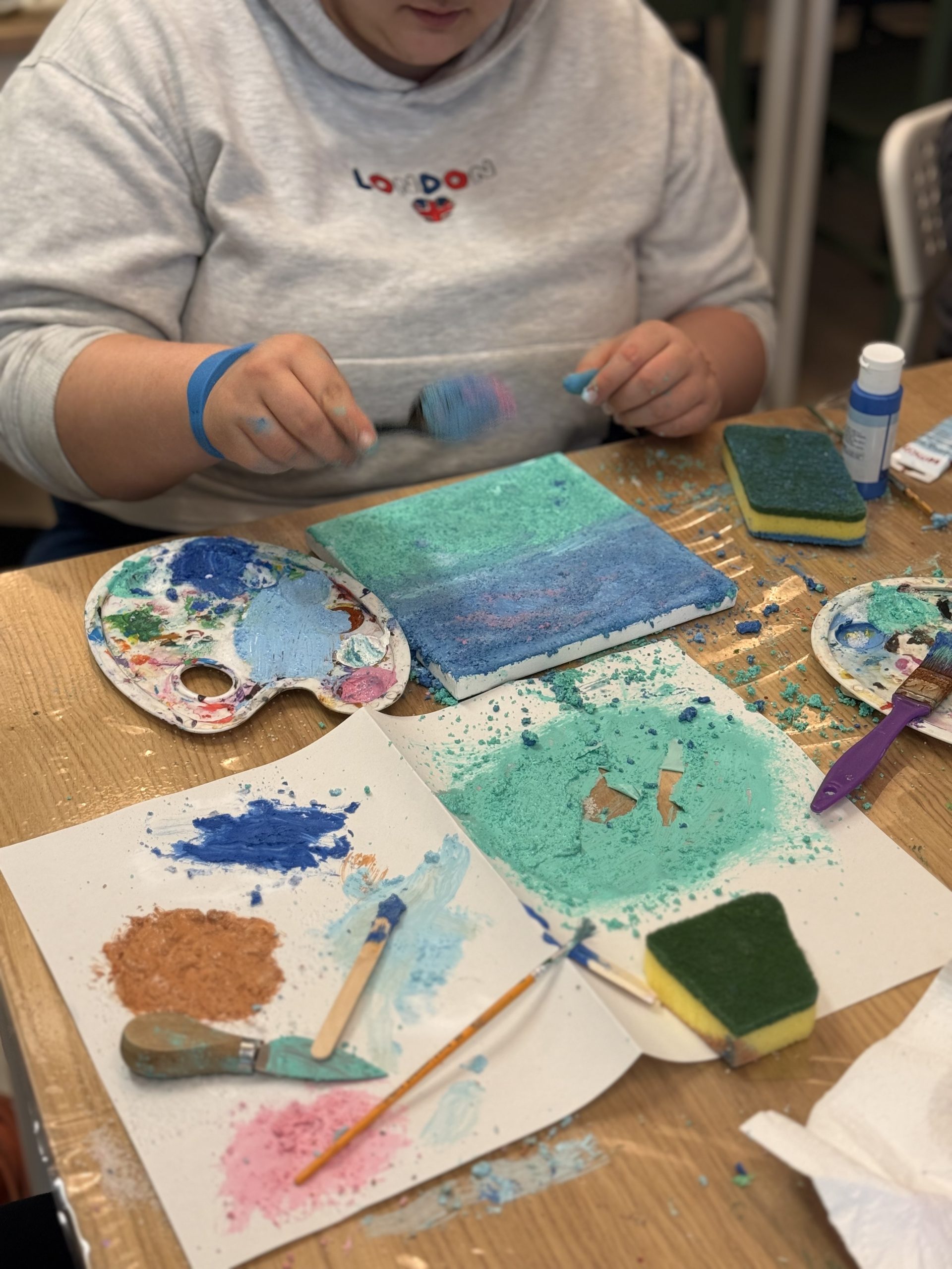 A participant painting at the YAY Today art class in Ormond