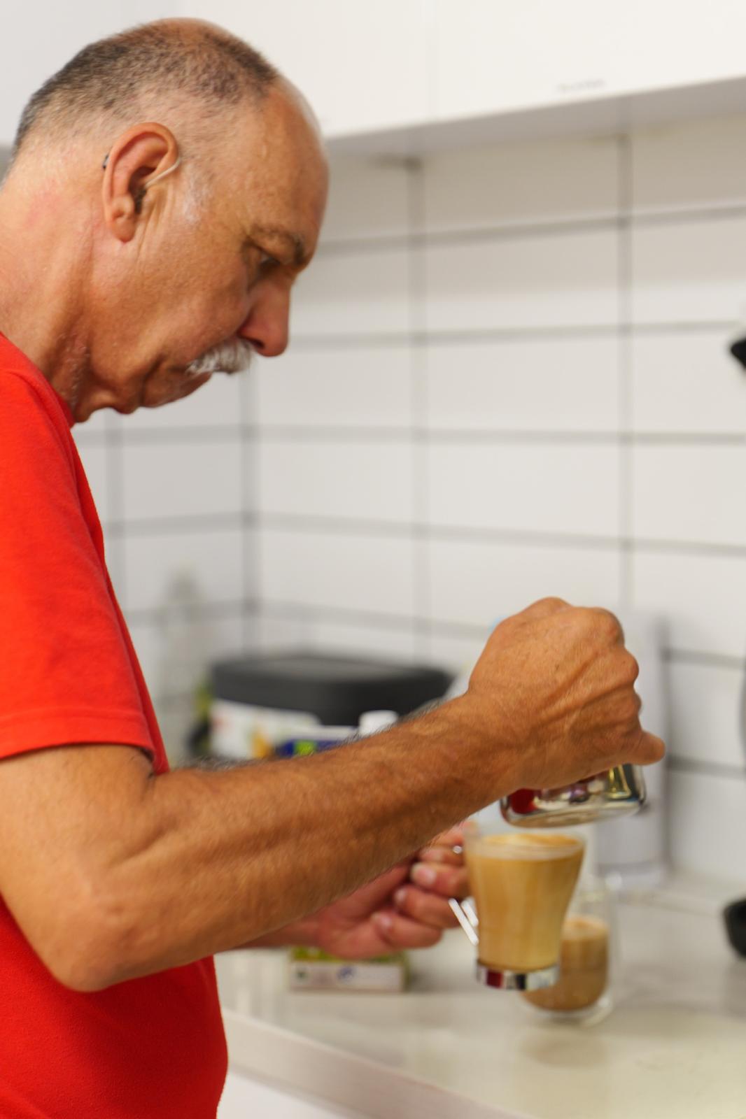 A participant serving coffee at YAY Today