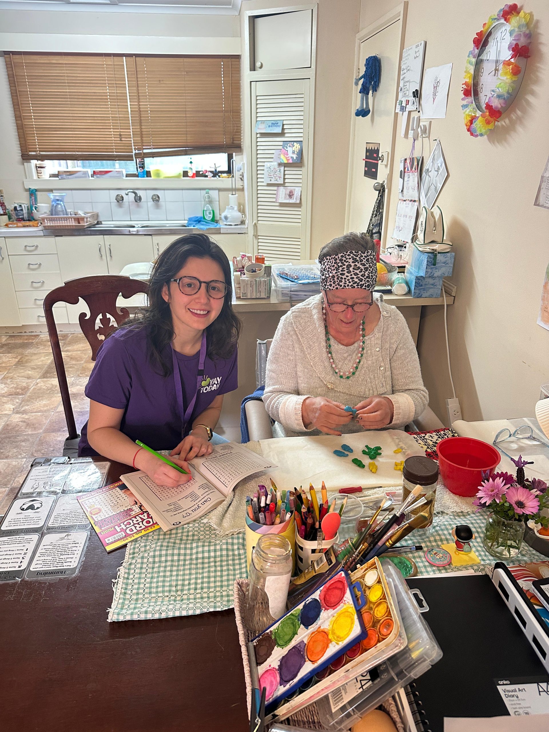 Support worker and participant at home together